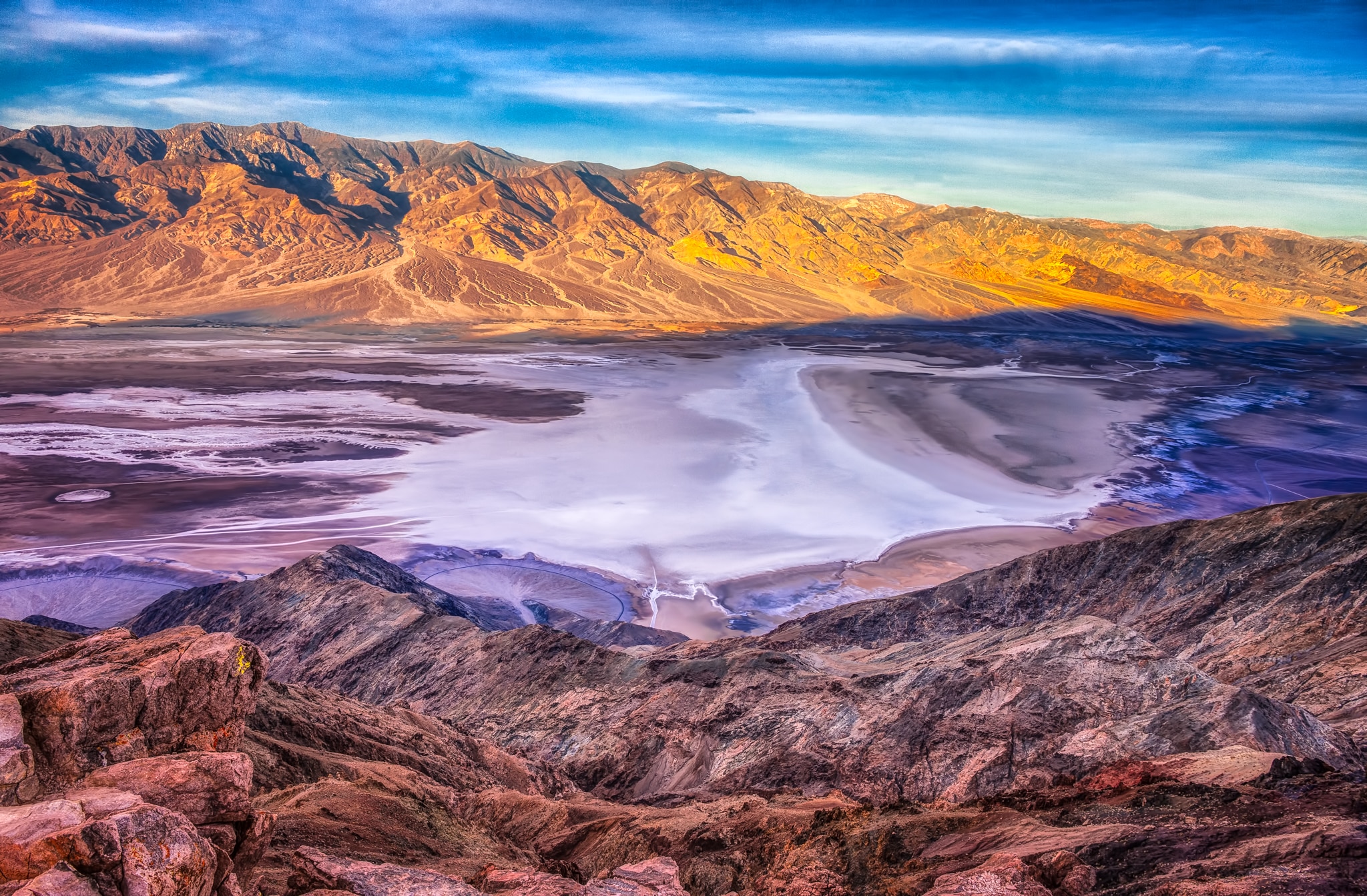 A view of Badwater Basin and the Panamint Mountains in the distance from Dante's View, in the Black Mountains, 13 miles southwest of Highway 190 in Death Valley National Park, California. Notice the alluvial fans in the lower left quadrant.