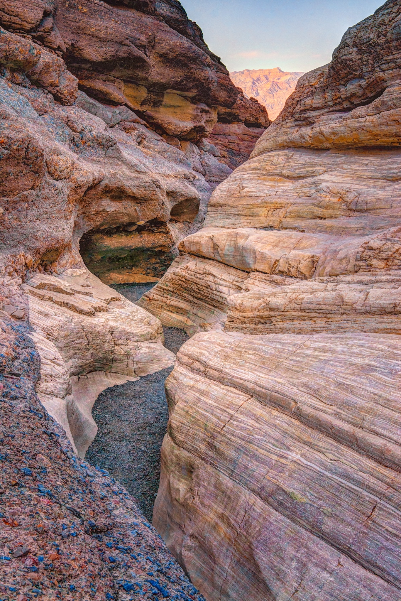 Looking up this wineglass-type canyon, you can see how water has carved a sinuous path through the Noonday dolomite of Mosaic Canyon, located a short distance up a dirt road just west of Stovepipe Wells in Death Valley National Park, California.