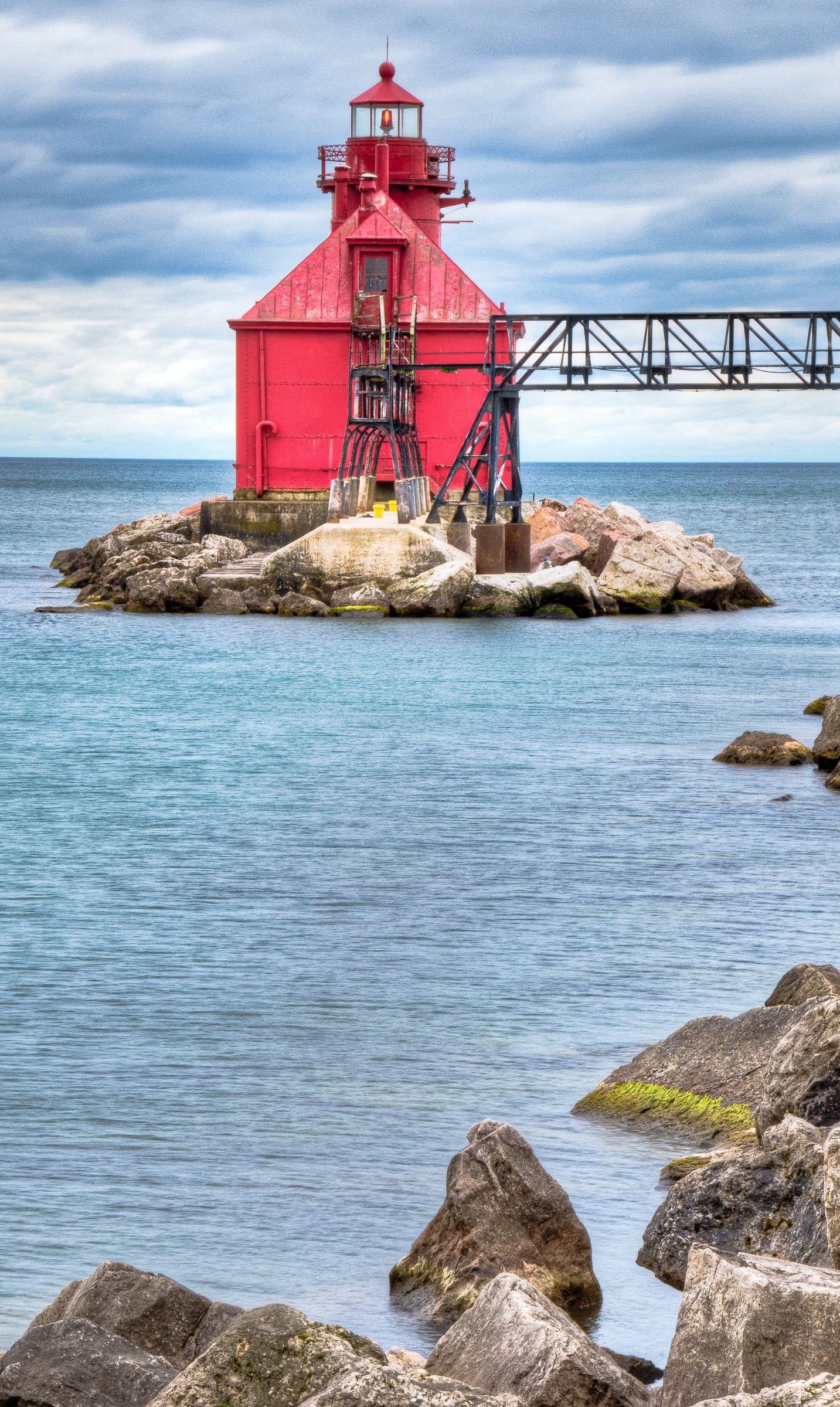 Traditional lighthouse at the end of a jetty at the Lake Michigan end of the Sturgeon Bay channel.