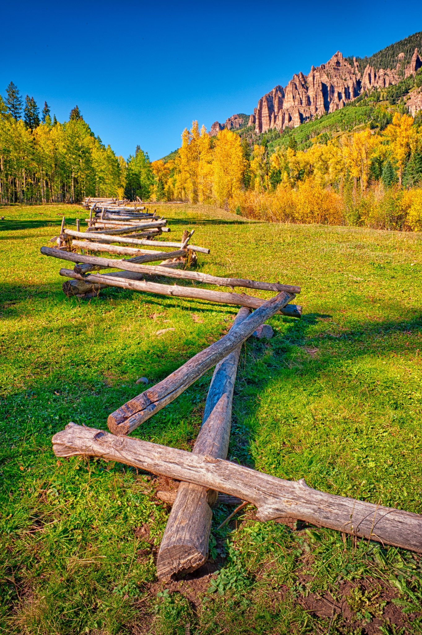A zig-zag log fence leads your eye up to the Cimarron Mountains on CR 861 near Silver Jack Reservoir, near Cimarron, Colorado.