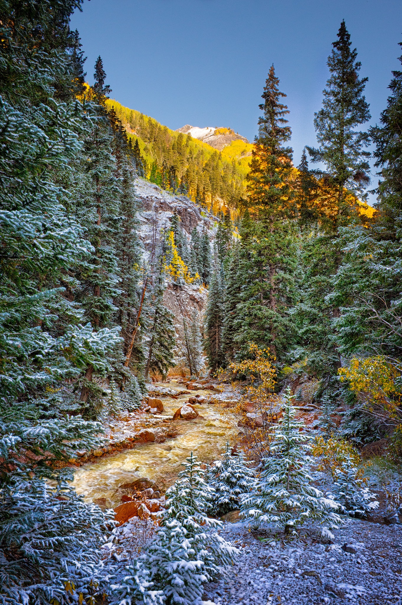 A view of a mountain stream taken after a dusting of snow along the Million Dollar Highway outside Ouray, Colorado.