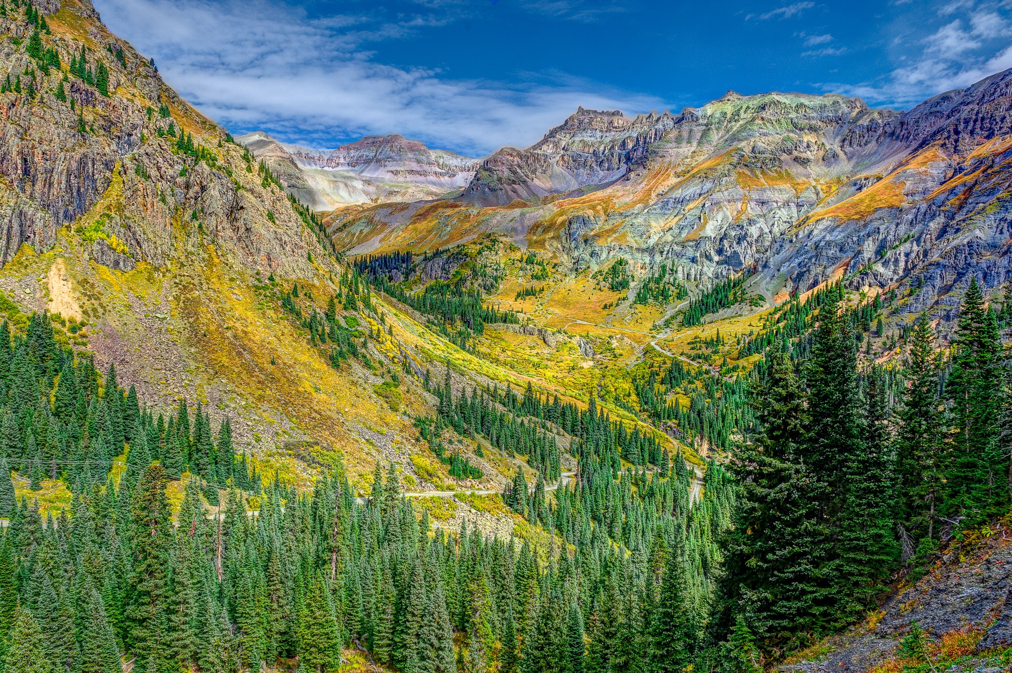 A view back along Governor's Basin Road toward Yankee Boy Basin, with Lower Twin Falls in the distance.