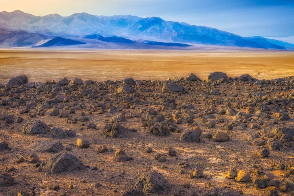 Mars Hill and Ventifact Ridge are on the opposite side of Badwater Road from Artist's Drive in Death Valley National Park. Boulders of basalt are strewn over the desert pavement on these two high-point overlooking Badwater Basin.