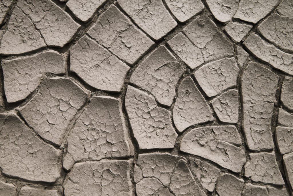 These cracked mudflats are visible along a dirt road that heads west from the airstrip at Stovepipe Wells in Death Valley National Park, California.