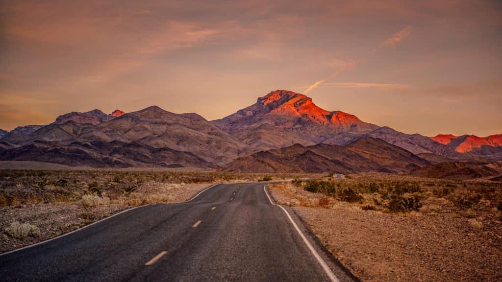 Corkscrew Peak glows orange-red as we head northeast on Daylight Pass Road toward Rhyolite Ghost Town, which is just outside the boundary of Death Valley National Park near Beatty, Nevada.