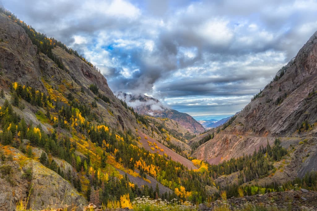 A view north up the valley of the Uncompahgre River as it flows alongside US 550 as it heads to Ouray, Colorado.. Notice: No guardrails!