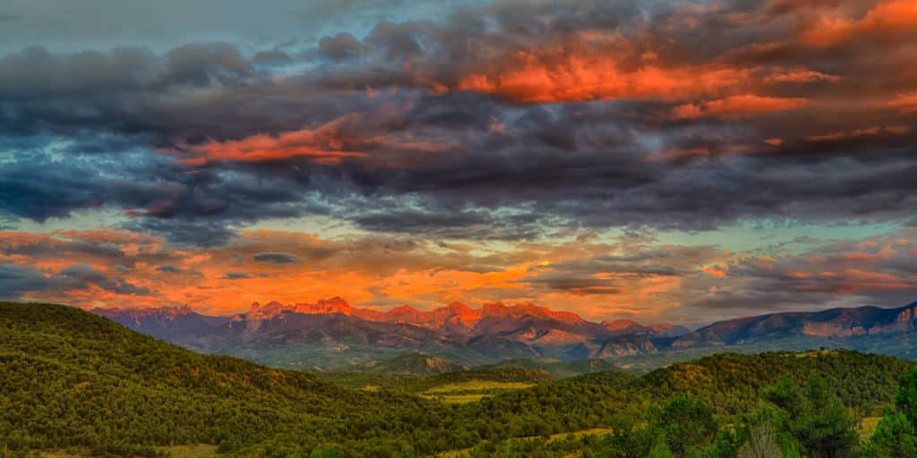 The last bit of light turns the Comarron Mountains red. Taken from Ridgway State Park near Ridgway, Colorado.
