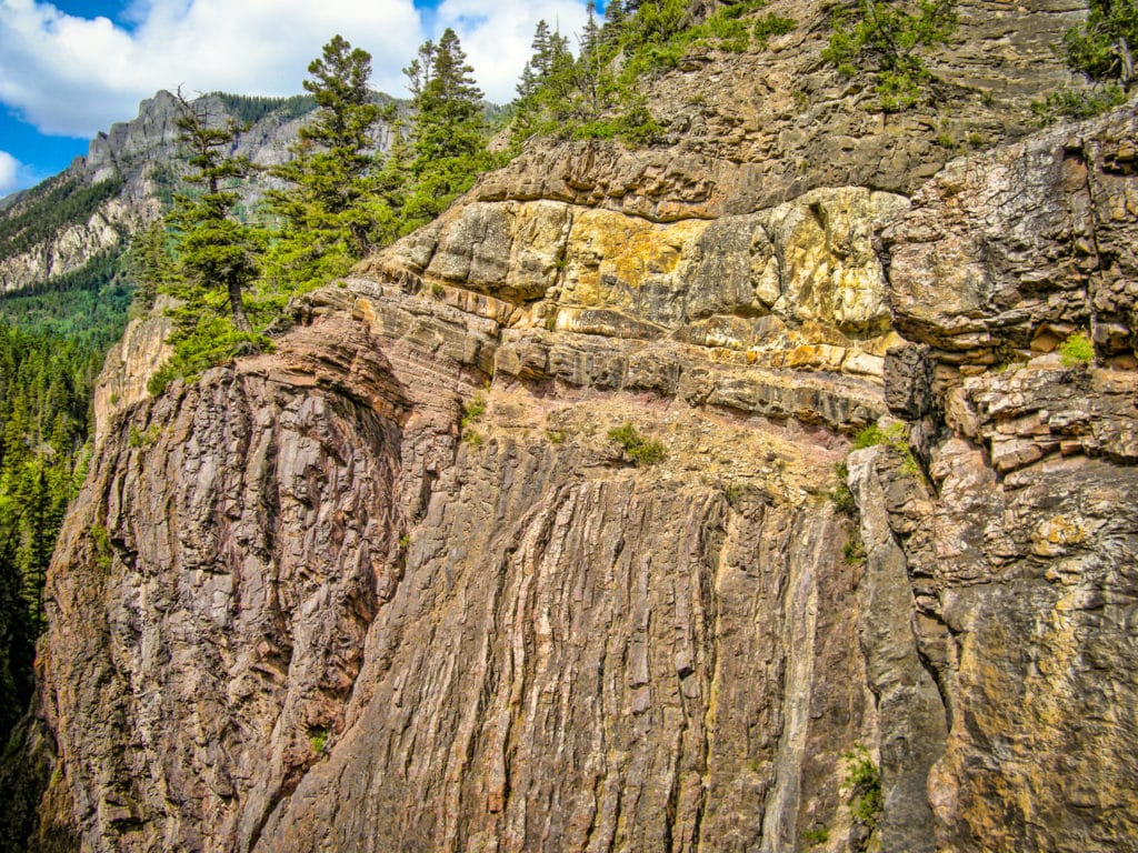 Intersecting rock layers that are used in many textbooks to illustrate an angular unconformity. In Box Canyon, Ouray, Colorado.