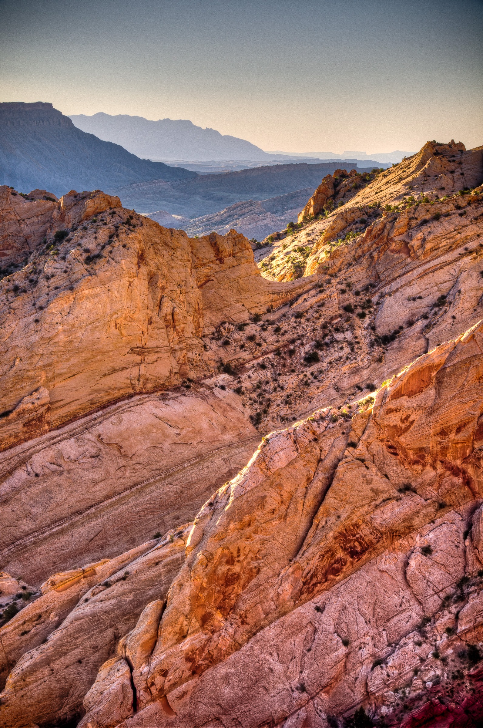 Looking southeast through uptilted layers of the Waterpocket Fold along Burr Trail in Capitol Reef National Park, Utah.