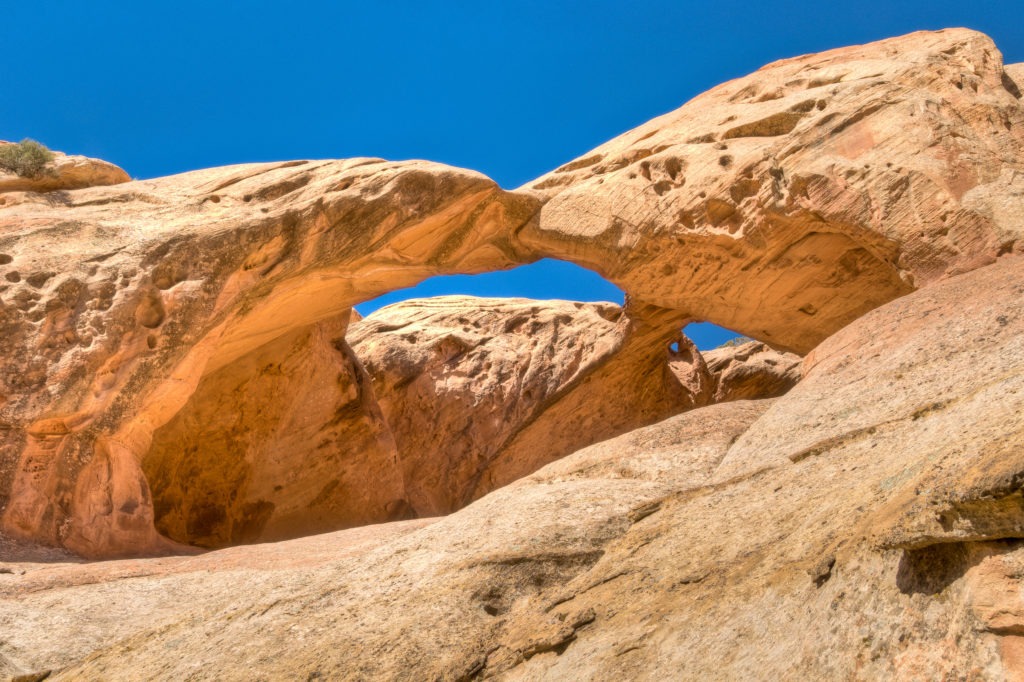 Double arch in the Keyenta Sandstone along Upper Muley Twist Canyon near the Strike Valley Overlook trailhead in Capitol Reef National Park.