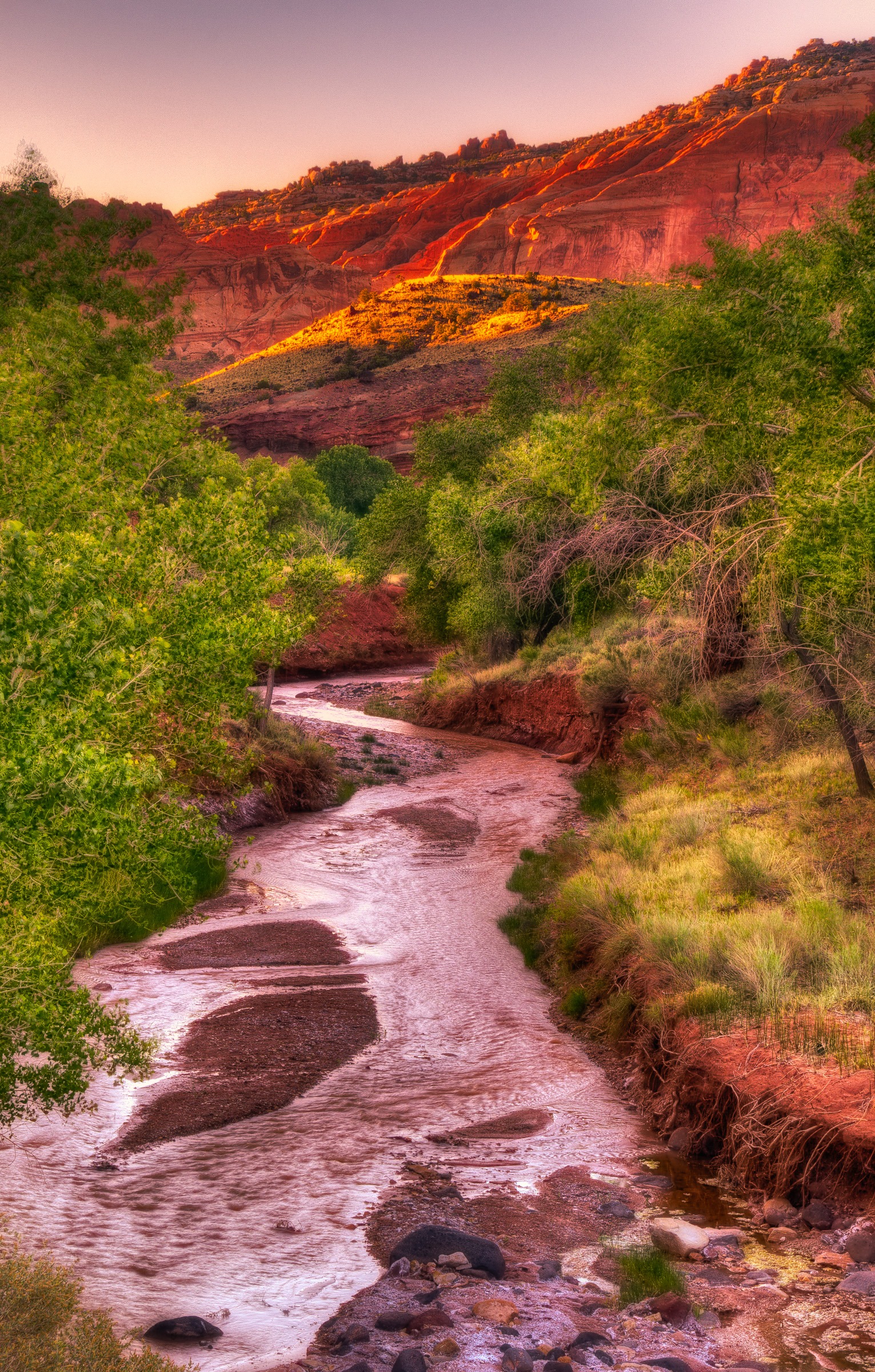 The first light catches the edges of cliffs above Sulphur creek just upstream of its junction with the Fremont River in Capitol Reef National Park.