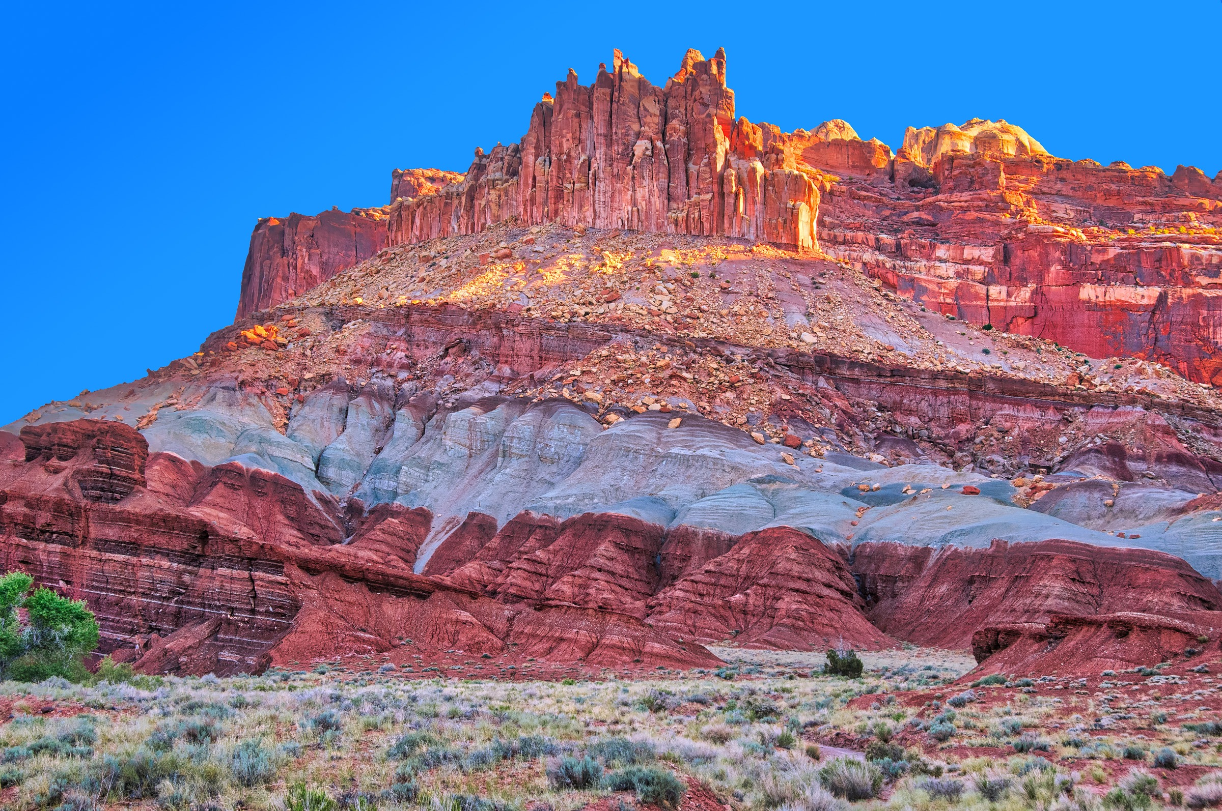 The Castle, near the Capitol Reef National Park Visitor's Center, glows in the morning light.