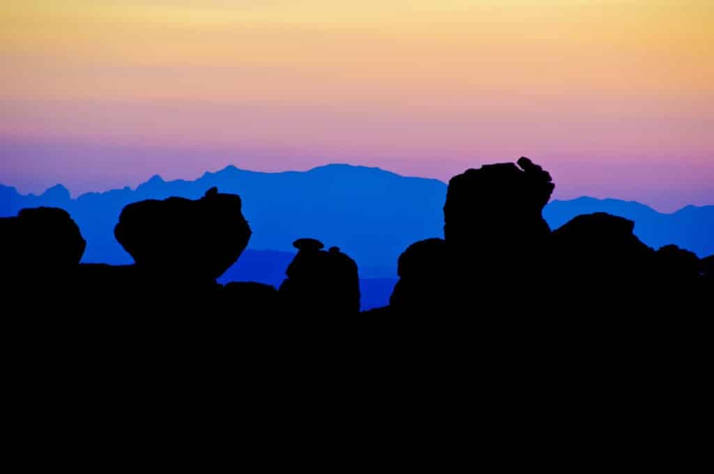 Columns of Rhyolite Canyon Tuff silhouetted by twilight color in Chiricahua National Monument.