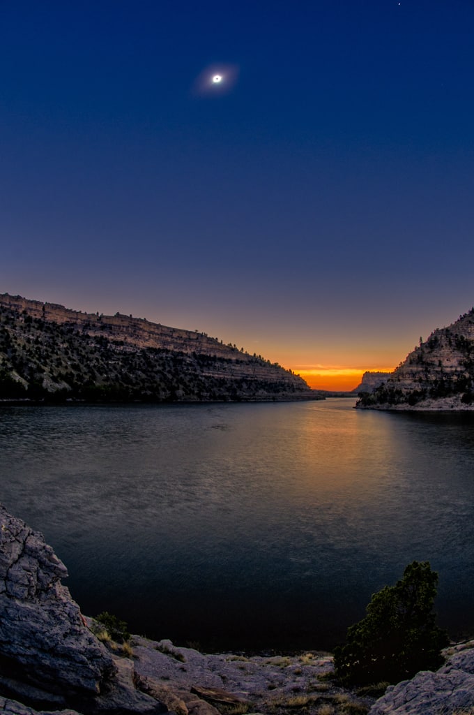 A false sunset at totality over Lake Guernsey in Guernsey State Park in Wyoming.