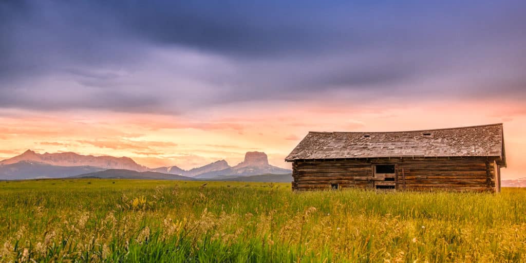 This log barn sits in the middle of a prarie, just east of theGlacier National Park boundary on Highway 89 between Babb and Conway, Montana. Montana Summer Landscapes