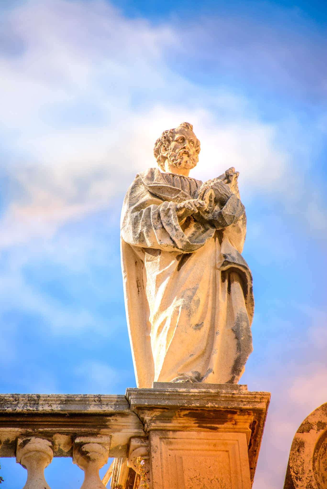 A close-up of one of the many statues that adorn the parapets of the Dubrovnik Cathedral in Dubrovnik Old Town in Croatia.