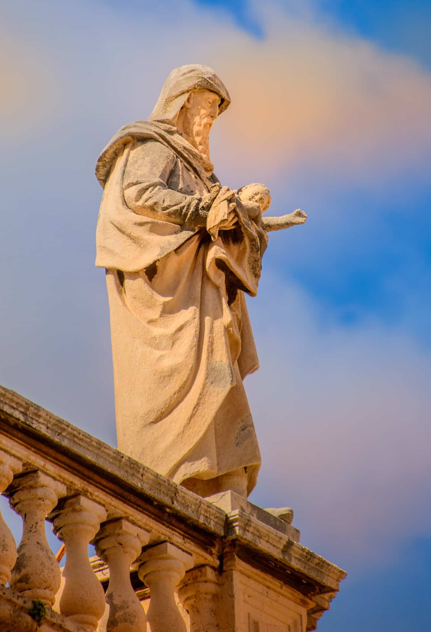 A close-up of one of the many statues that adorn the parapets of the Dubrovnik Cathedral in Dubrovnik Old Town in Croatia.