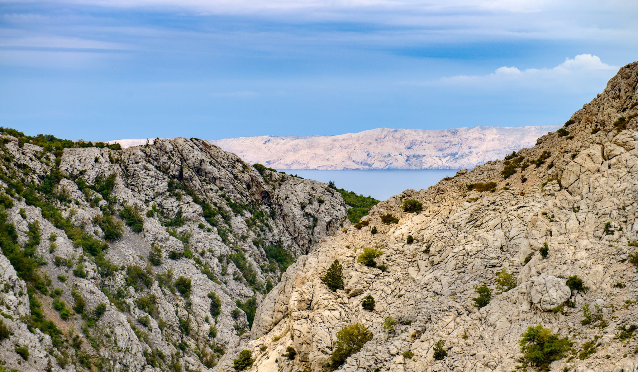 A view of the dolomite and limestone rock formations seen along the coastal road in northern Dalmatia in Croatia.