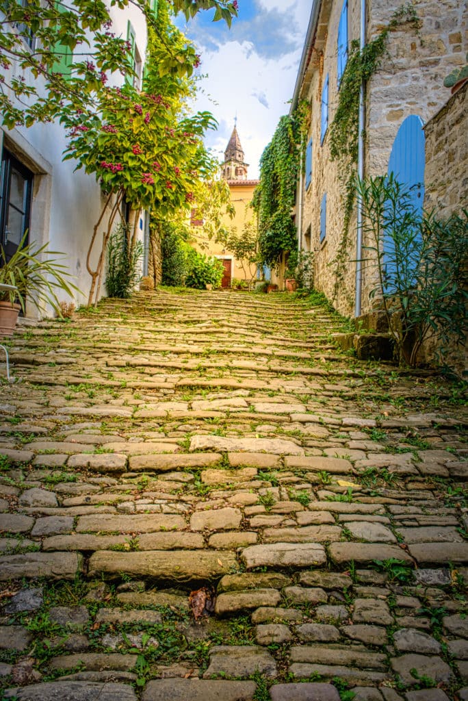 Looking up a stone paved street in the Medieval Istrian village of Motovun in Croatia.