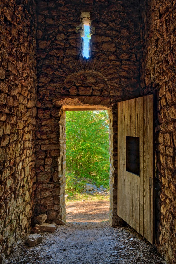 View from inside looking out through the front door of the Romanesque Church of St. Krševan located on the island of Krk in Croatia.