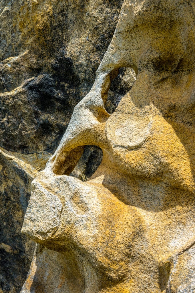 Darker rock shows through eroded holes in lighter granite in City of Rocks National Reserve inear Almo, Idaho.