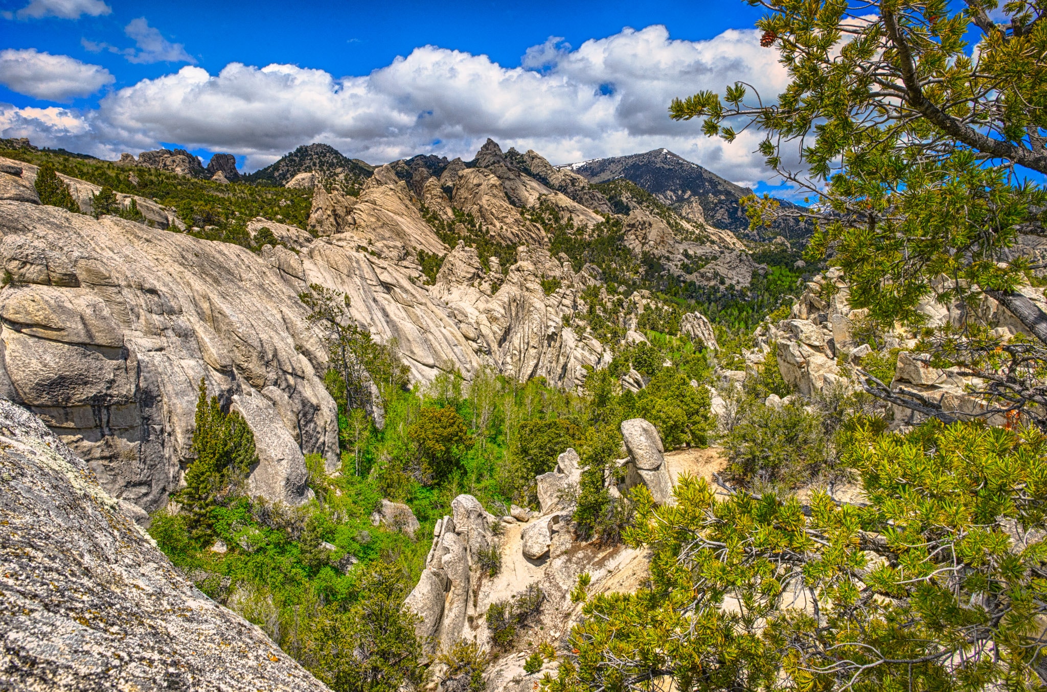 A view across the canyon from Window Arch to weathered granite mountains in City of Rocks National Reserve, near Almo, Idaho.