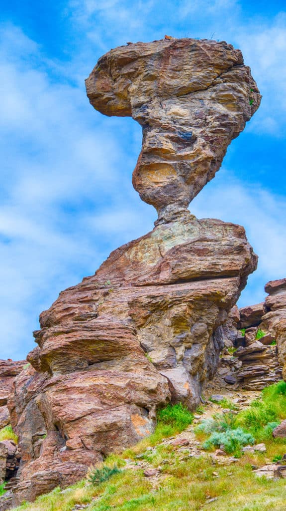 Balanced Rock, located on BLM land near Balanced Rock Park, is a rock formation of wind-carved rhyolite. Because vandals have attempted to topple the rock at various time in the past, the small neck has been reinforced with concrete.