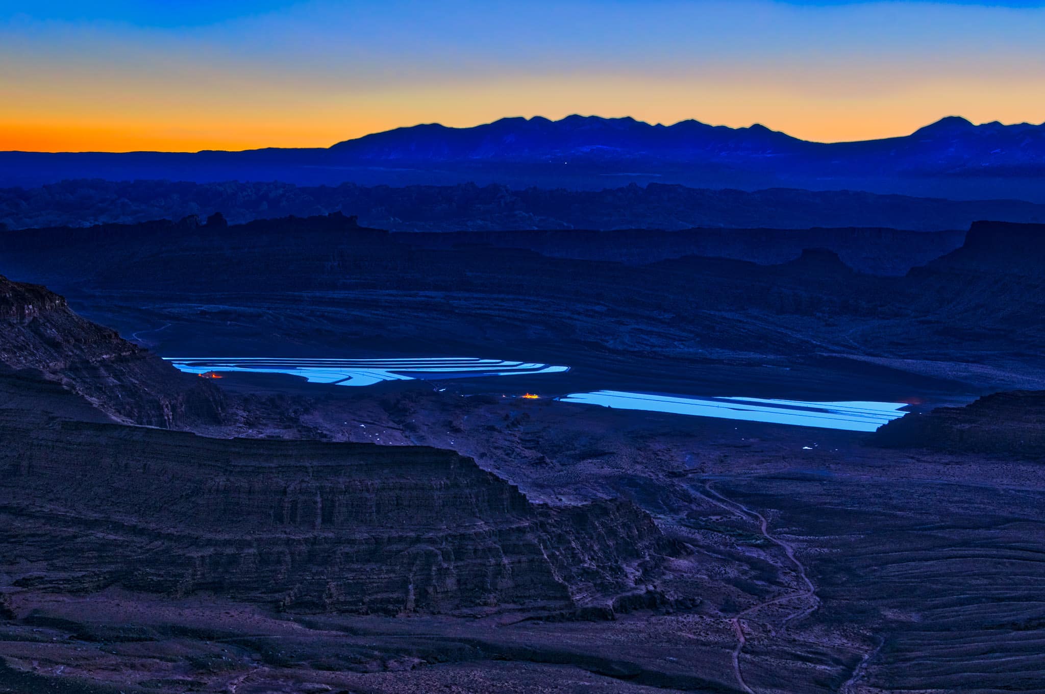 Predawn sky reflected in evaporative ponds of a potash mine southeast of Moab, Utah.