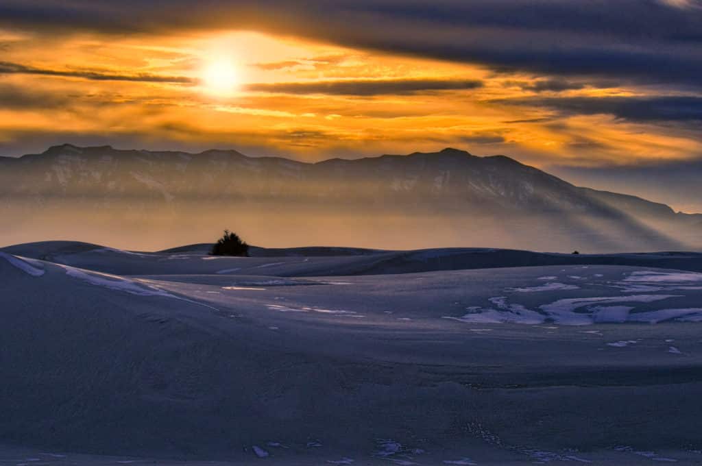 The setting sun accentuates the haze in White Sands National Monument in New Mexico.