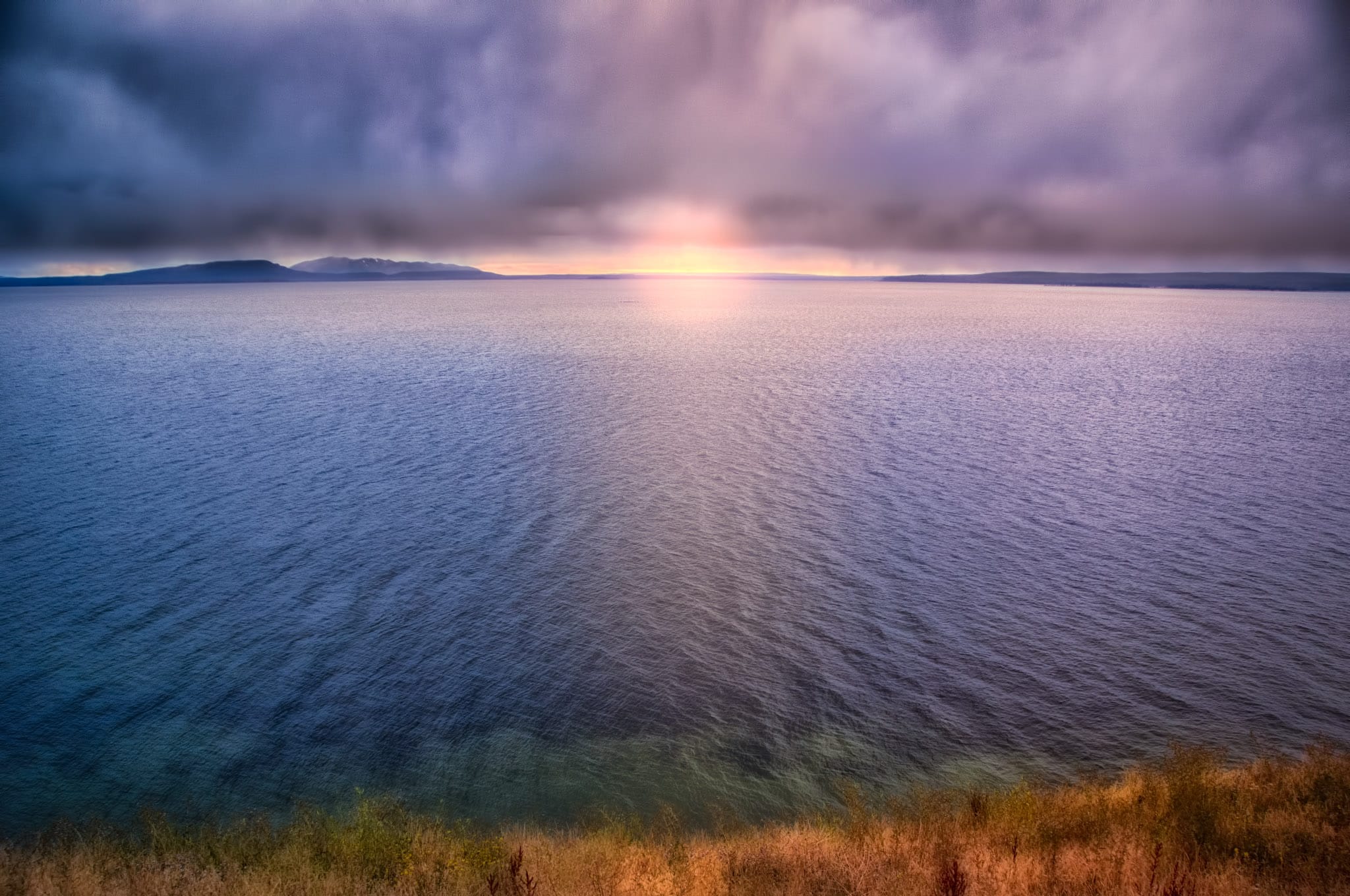 Stormy Sunset at Yellowstone Lake from Steamboat Point in Yellowstone National Park, Wyoming.