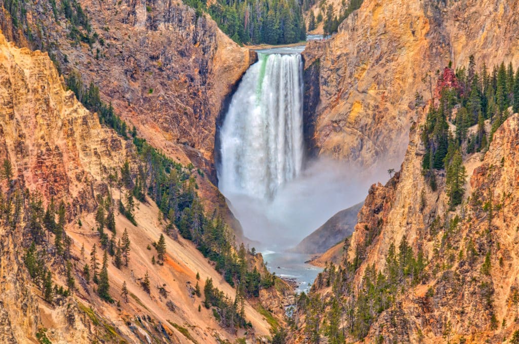 Lower Falls of the Yellowstone River. The green stripe is the natural color of the water unchurned by the turbulence of the falls.