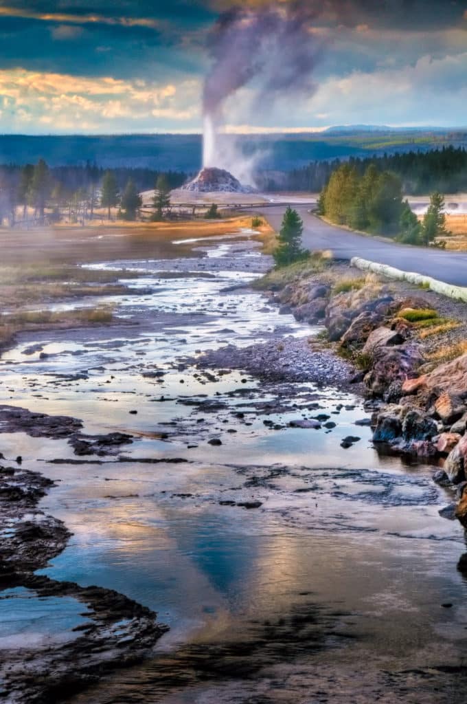 Runoff from Great Fountain Geyser heads to erupting White Dome Geyser in Yellowstone National Park, Wyoming.