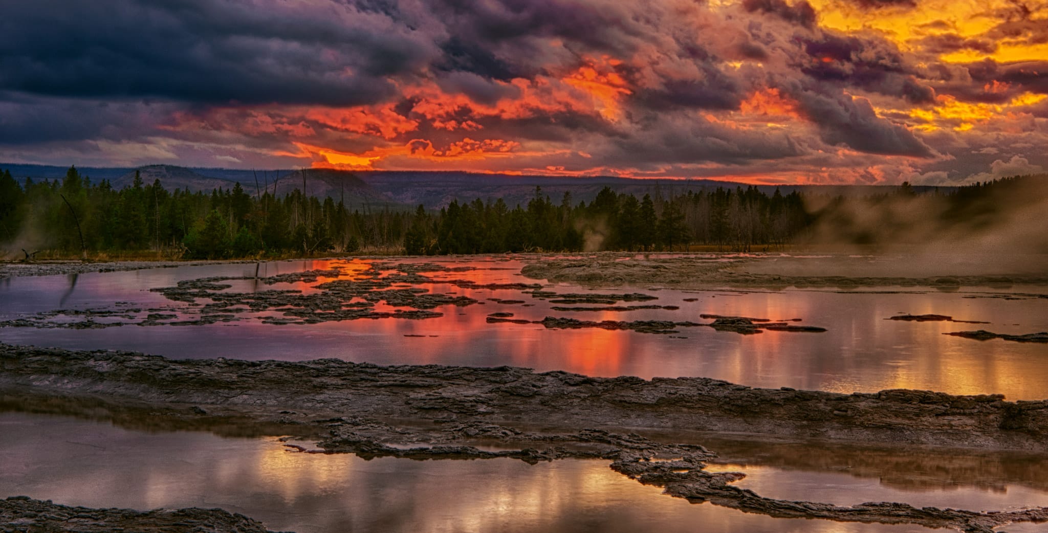 View of Great Fountain Geyser at sunset in Yellowstone National Park, Wyoming.