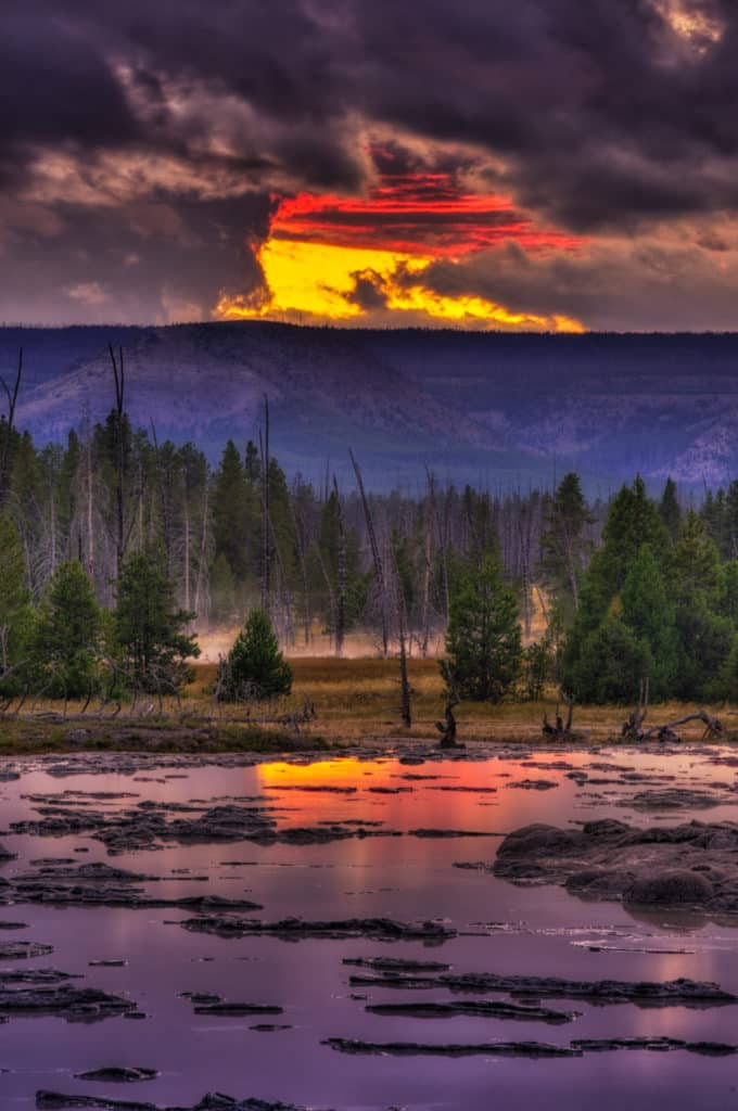 View of Great Fountain Geyser at sunset in Yellowstone National Park, Wyoming.