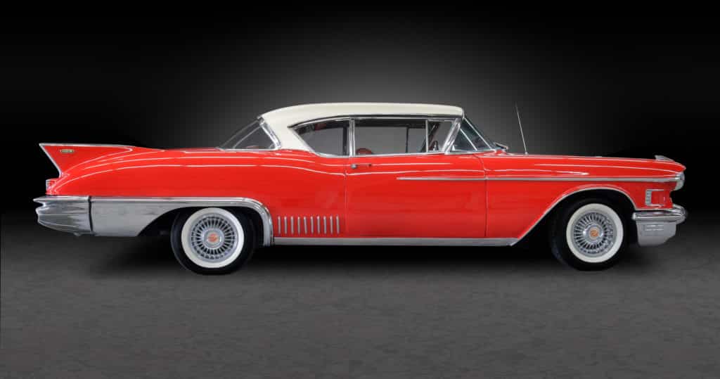 1958 Cadillac Eldorado Seville with red body and white rood and red, leather interior.