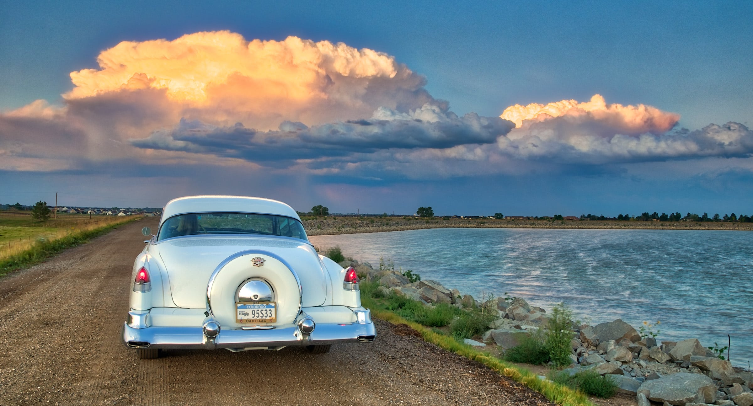 1953 Cadillac Coupe deVille - Rear view with Continental Kit. Storm clouds in the distance.