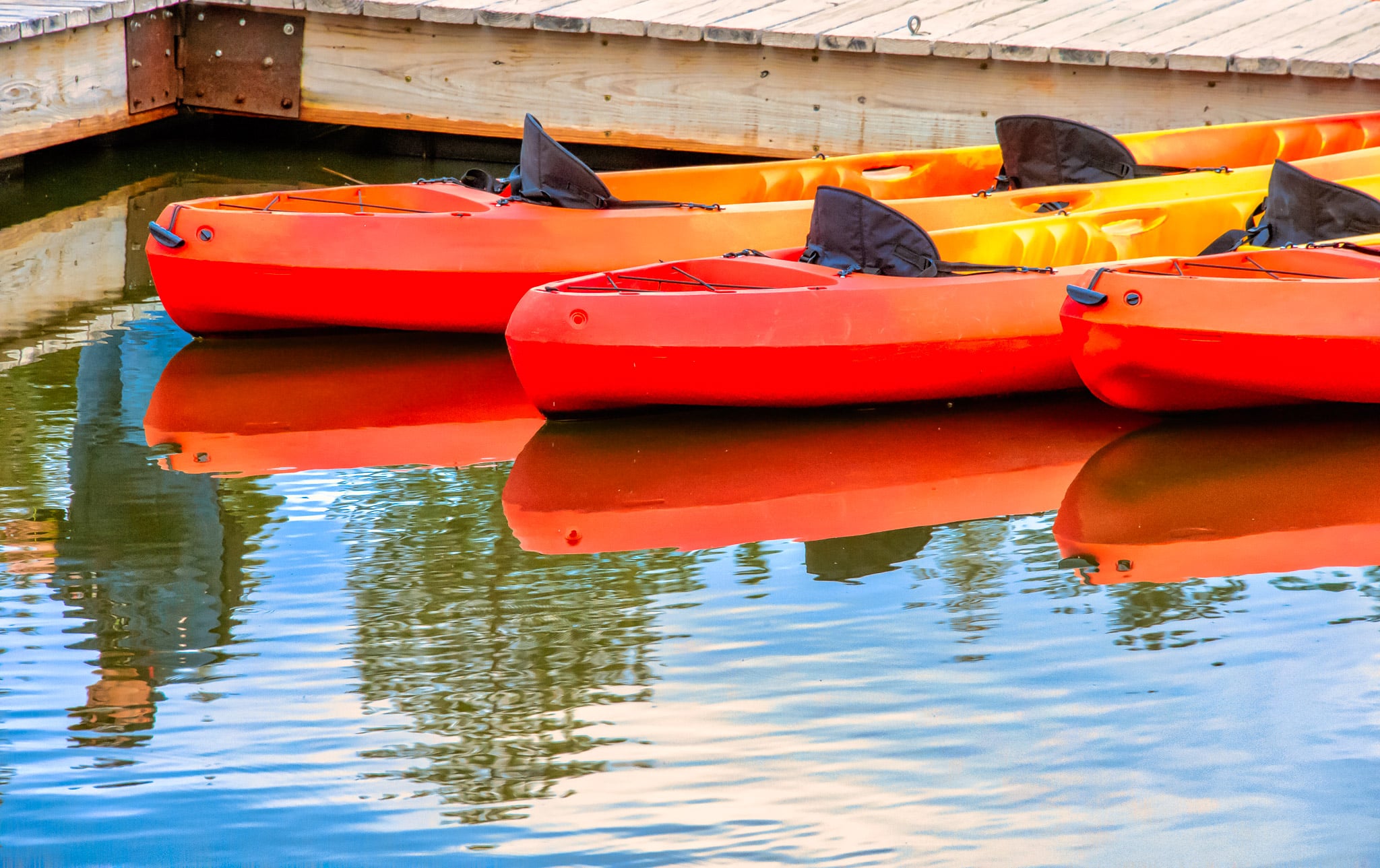 Colorful canoes await visitors to Sylvan Lake Day Use Area in Custer State Park, South Dakota.