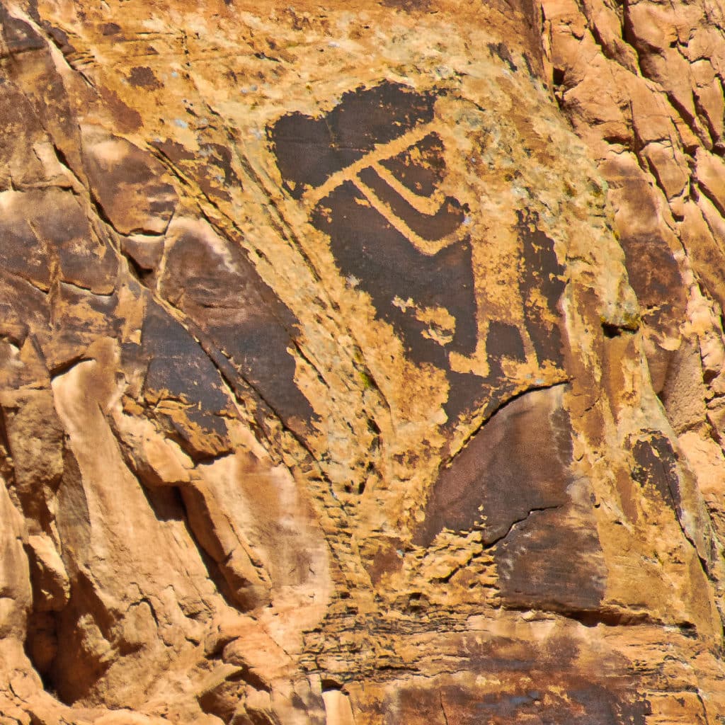 Petroglyph of Kokopelli serenading tourists along Cub Creek Road In Dinosaur National Monument.