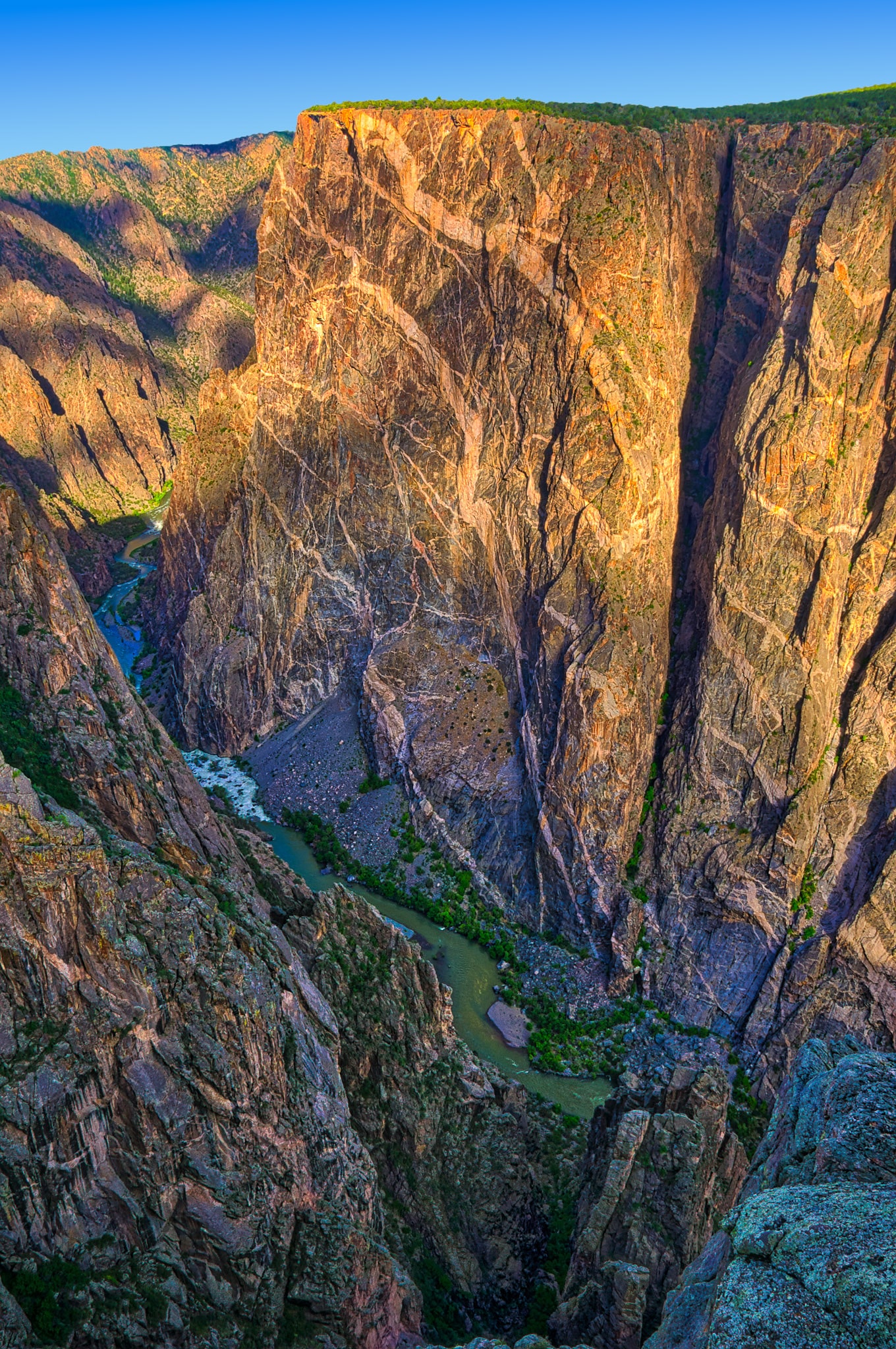 Early morning view of the Painted Wall and the Gunnison River from the south rim of the Black Canyon of the Gunnison National Park near Montrose, Colorado.