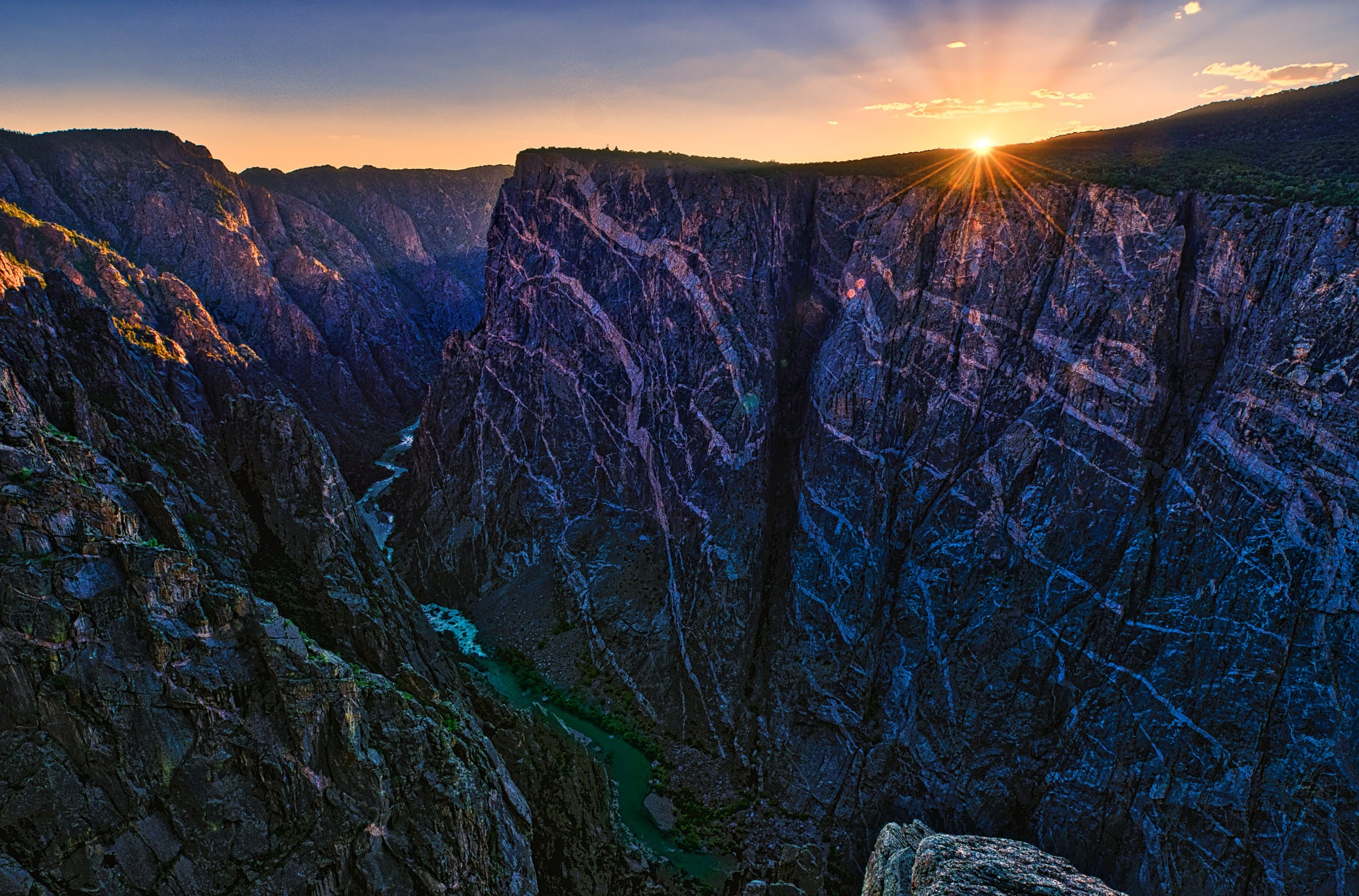 A view of the Painted Wall at sunset in Black Canyon of the Gunnison National Park in Colorado from the Painted Wall View overlook.