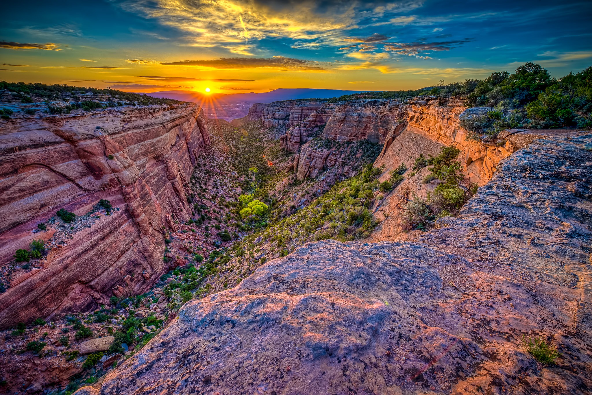 Sunrise illuminates Red Canyon in Colorado National Monument, near Grand Junction, on the Colorado Plateau.