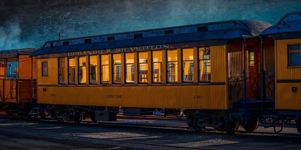 Durango & Silverton Railroad's Cascade passenger car is part of a narrow-gauge train waiting at the Durango, Colorado, station for the next day's trip to Silverton, Colorado.