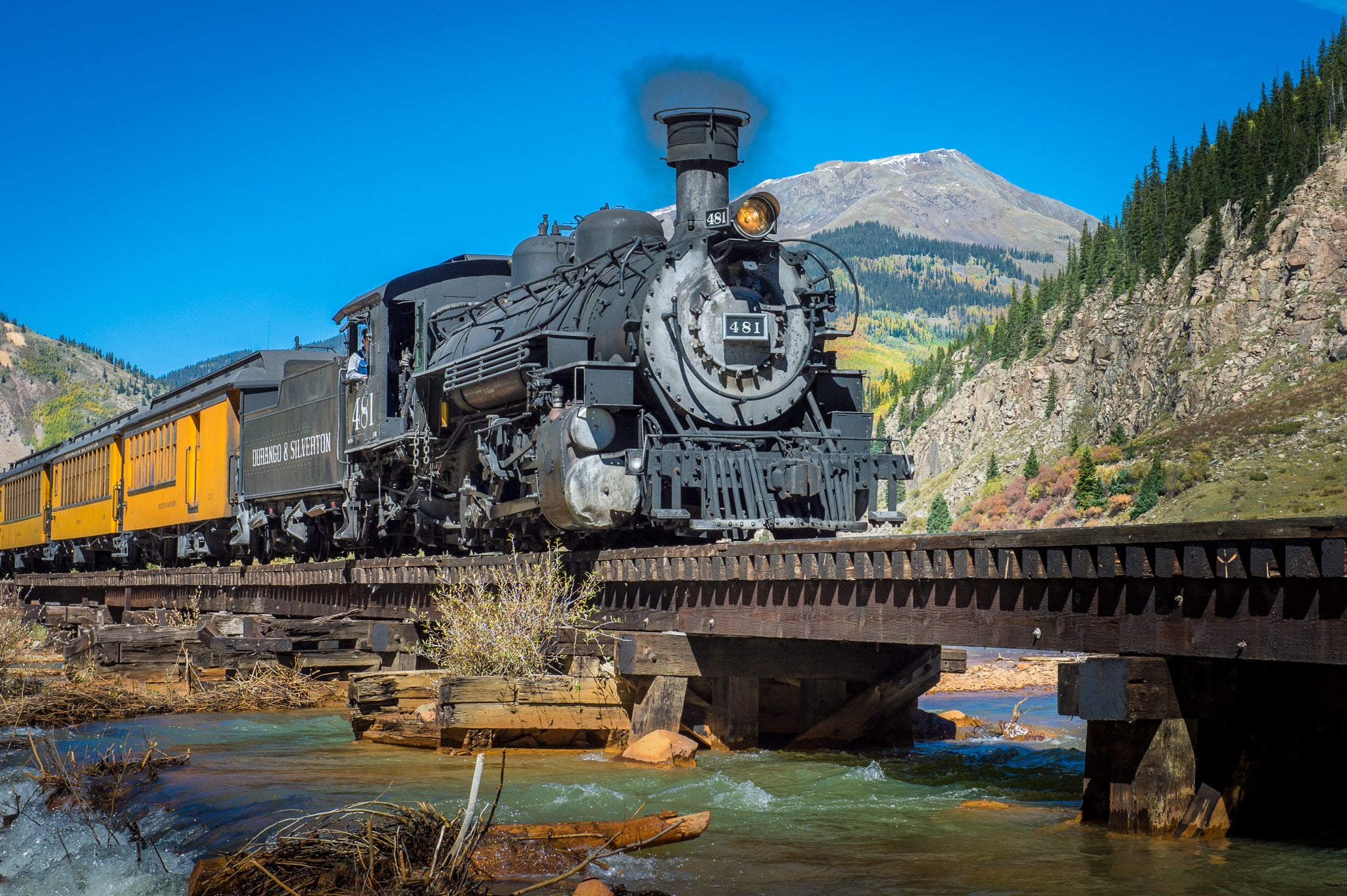 View of the autumn Durqango & Silverton Photography train as it makes its way along the Animas River between Durango and Silverton, Colorado.