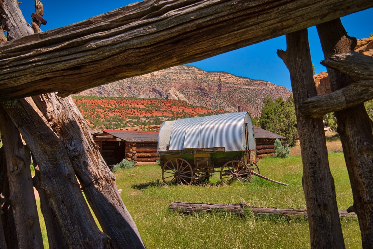 The old Chew Ranch lies on both sides of Echo Park Road in Dinosaur National Monument, Colorado. The surrounding cliffs provided protection and water to pioneer settlers in the late 1800s and early 1900s.. This picturesque sheep wagon provided shelter for folks looking after the wide-ranging livestock.