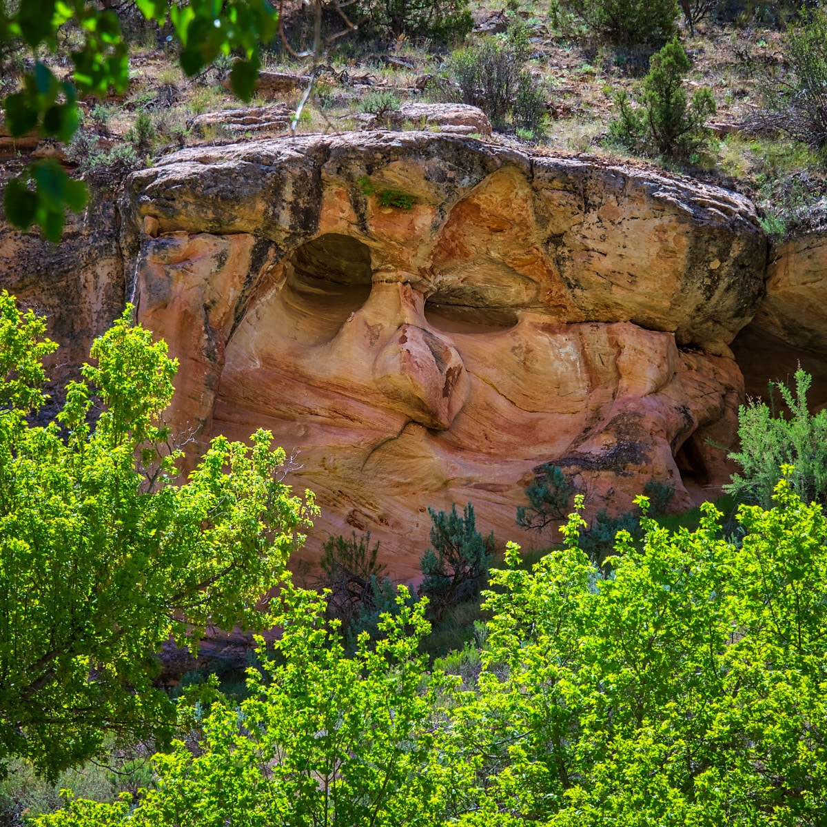 This formation is easy to miss. It is located on a sweeping curve along the creek on Echo Park Road, about half a mile before Whispering Cave.