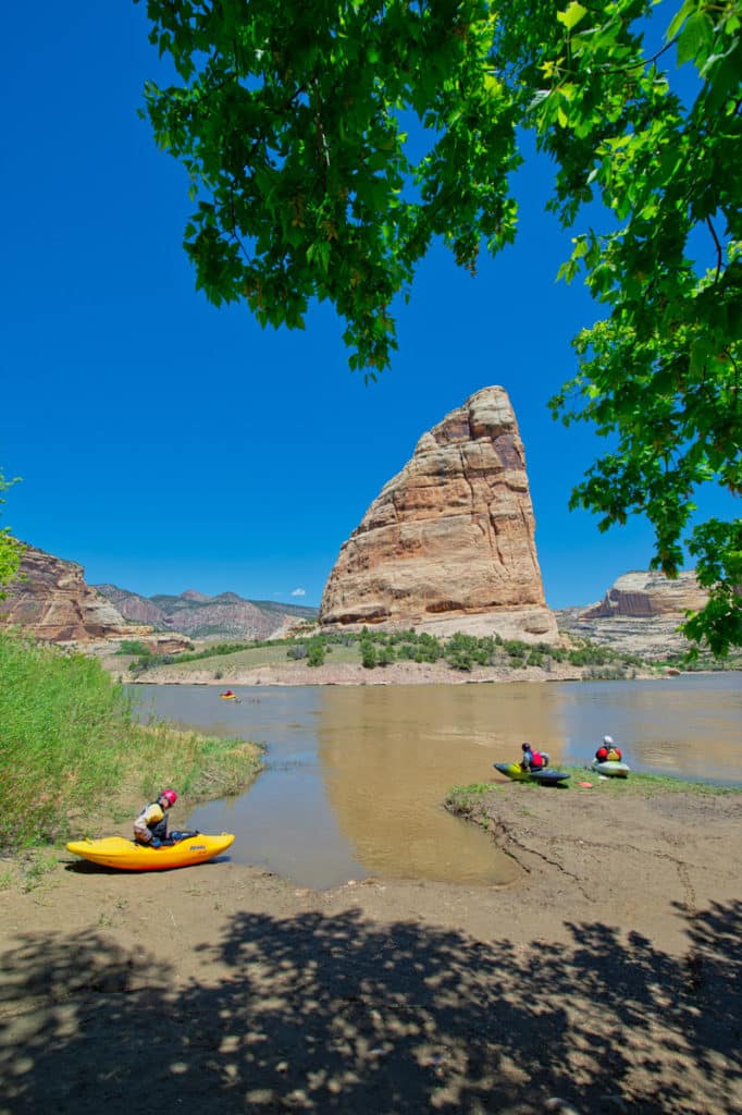 A group of kayakers put in at Steamboat Rock for the trip down to Split Mountain.
