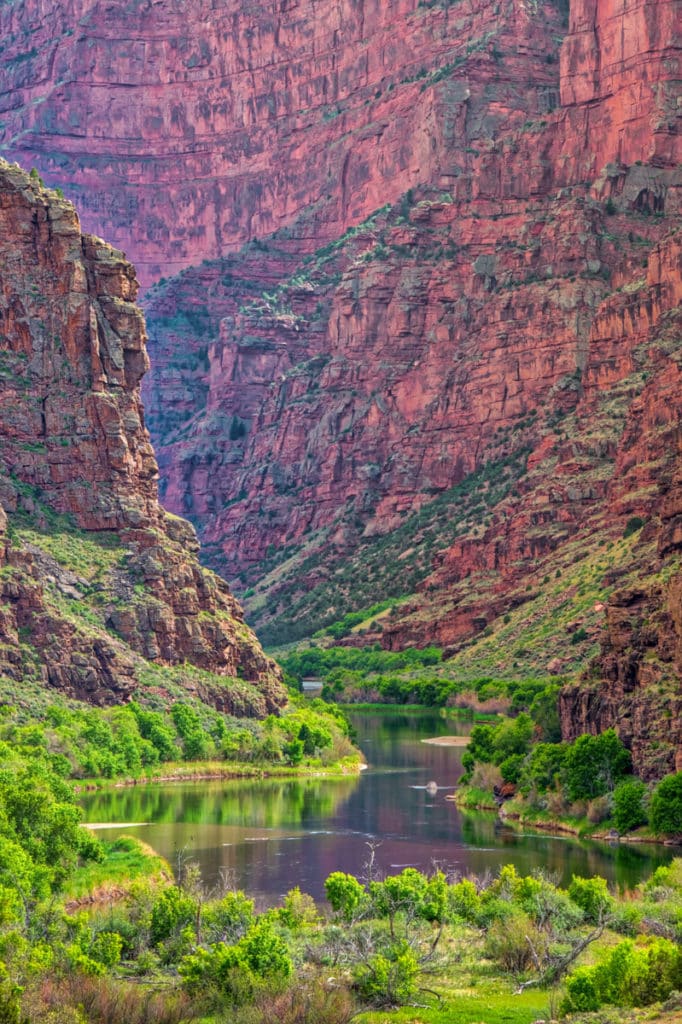 The placid Green River enters the imposing canyon, known as the Gates of Lodore, beginning its tumultuous journey through the canyon where it will join the Yampa River in Dinosaur National Monument, Colorado.