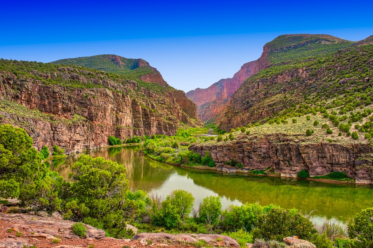 The placid Green River enters the imposing canyon, known as the Gates of Lodore, beginning its tumultuous journey through the canyon where it will join the Yampa River in Dinosaur National Monument, Colorado.