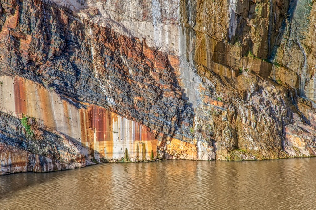 Rock layers visible at Theodore Roosevelt Dam along the Salt River on AZ 88 in Arizona.