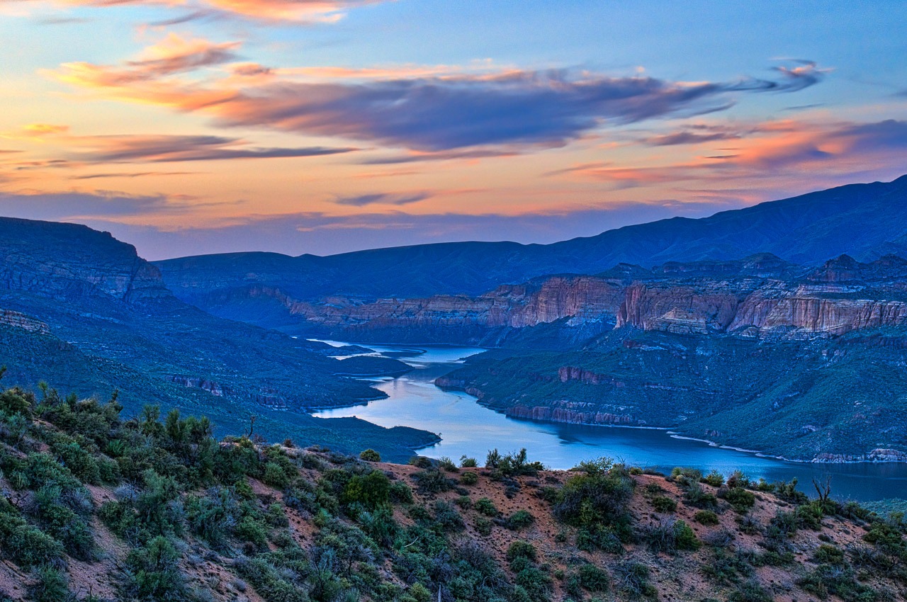 A view of Apache Lake at sunset from the Ravis Trailhead Road, off the apache Trail in Arizona.